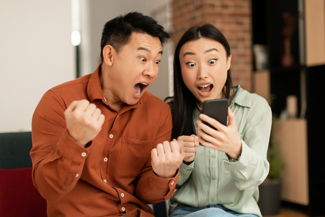 A viewer emotionally reacting to a heartfelt video on a smartphone screen.